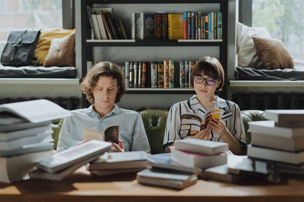 Creative introverted couple reading books